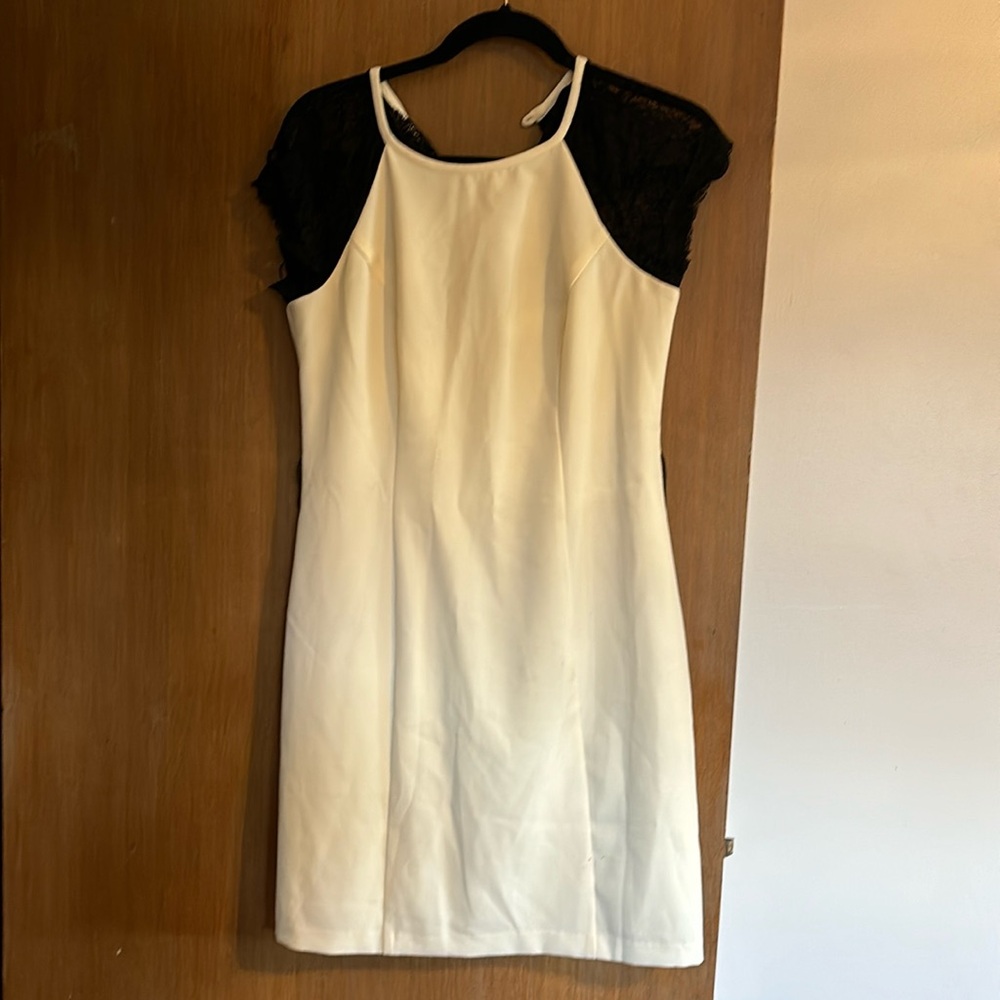 Cream colored dress with black lace sleeves size10